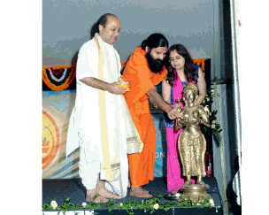 H.H. Swami Ramdevji and Pujya Bhupendrabhai at the deepa jyoti ceremony - Harrow Yog Science Workshop